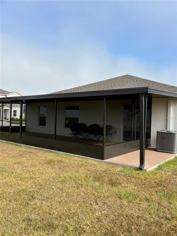 2405 Bluestone Road Haines City, FL 33844 - Photo 17 of 18 a house view with a swimming pool