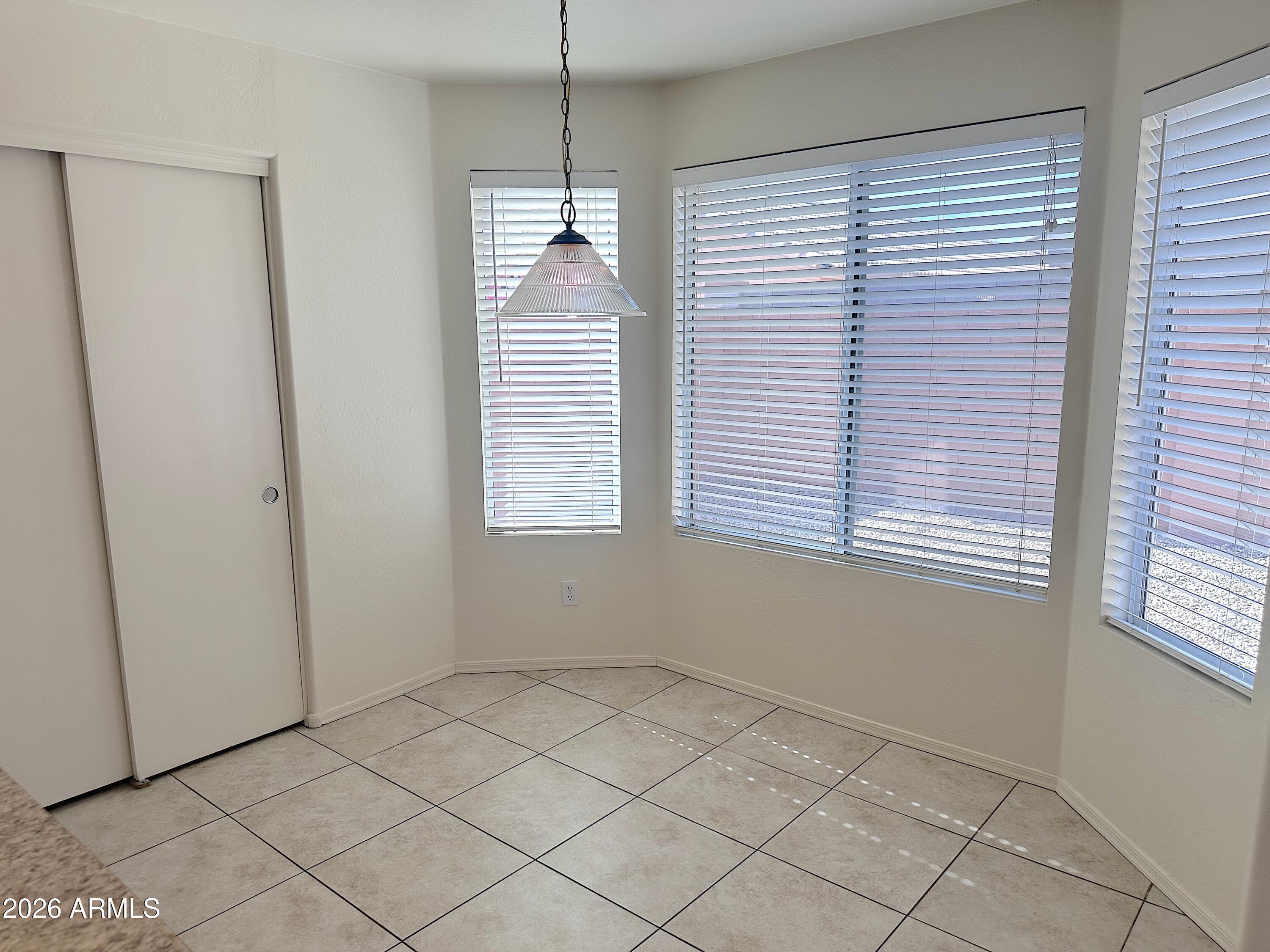 4106 East Chambers Street Phoenix, AZ 85040 - Photo 11 of 33 an empty room with windows