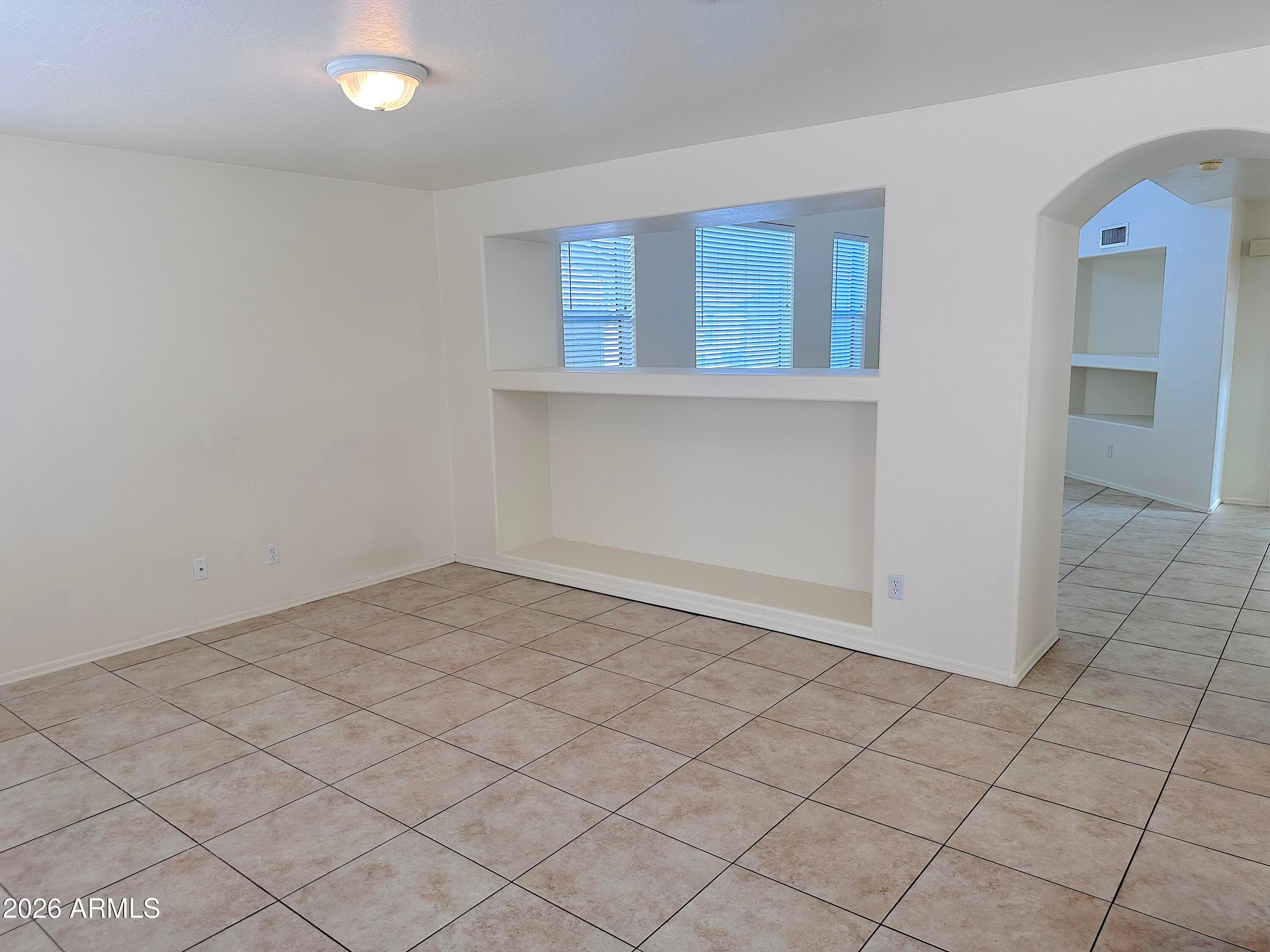 4106 East Chambers Street Phoenix, AZ 85040 - Photo 13 of 33 an empty room with windows
