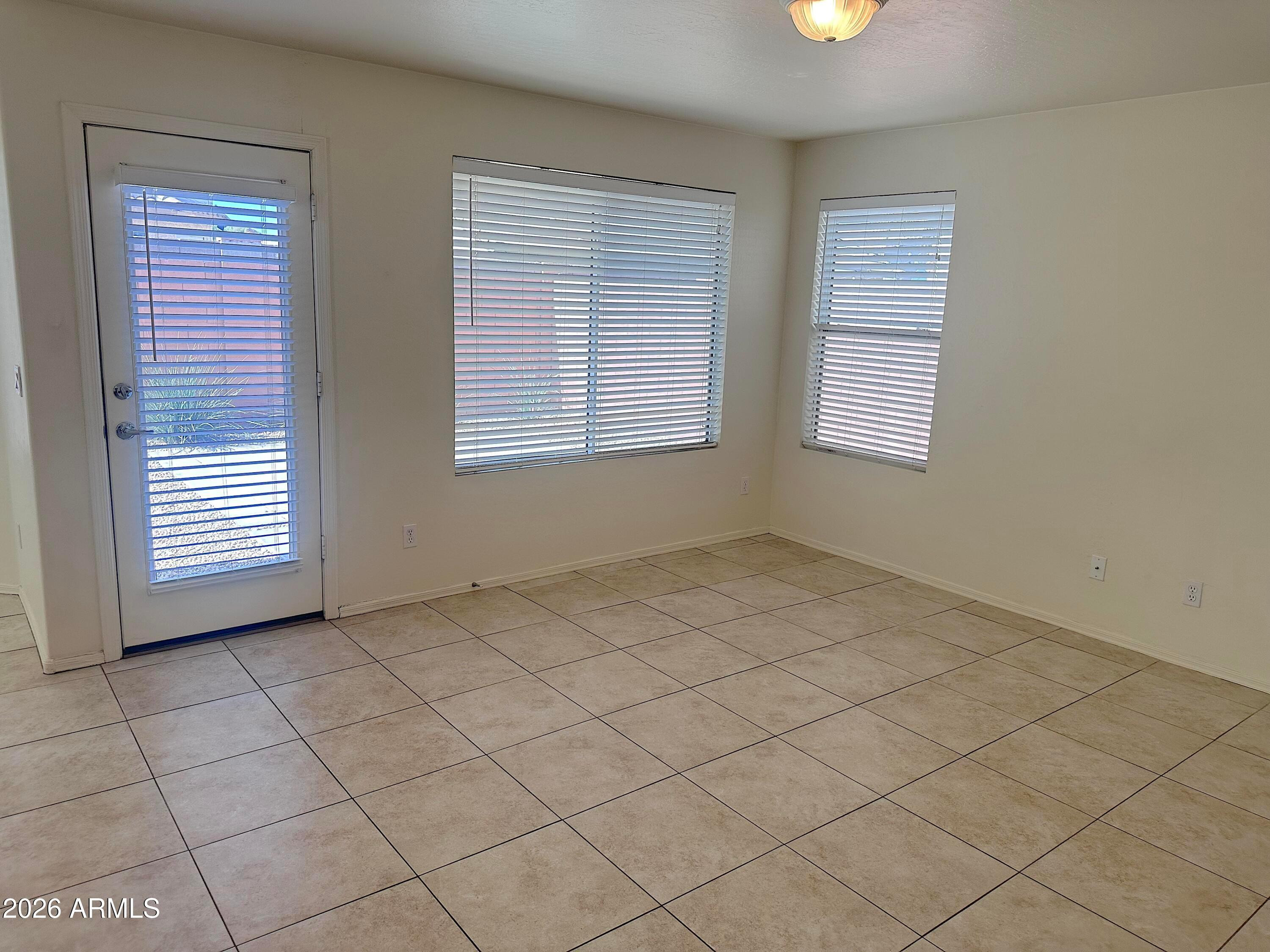 4106 East Chambers Street Phoenix, AZ 85040 - Photo 14 of 33 an empty room with windows
