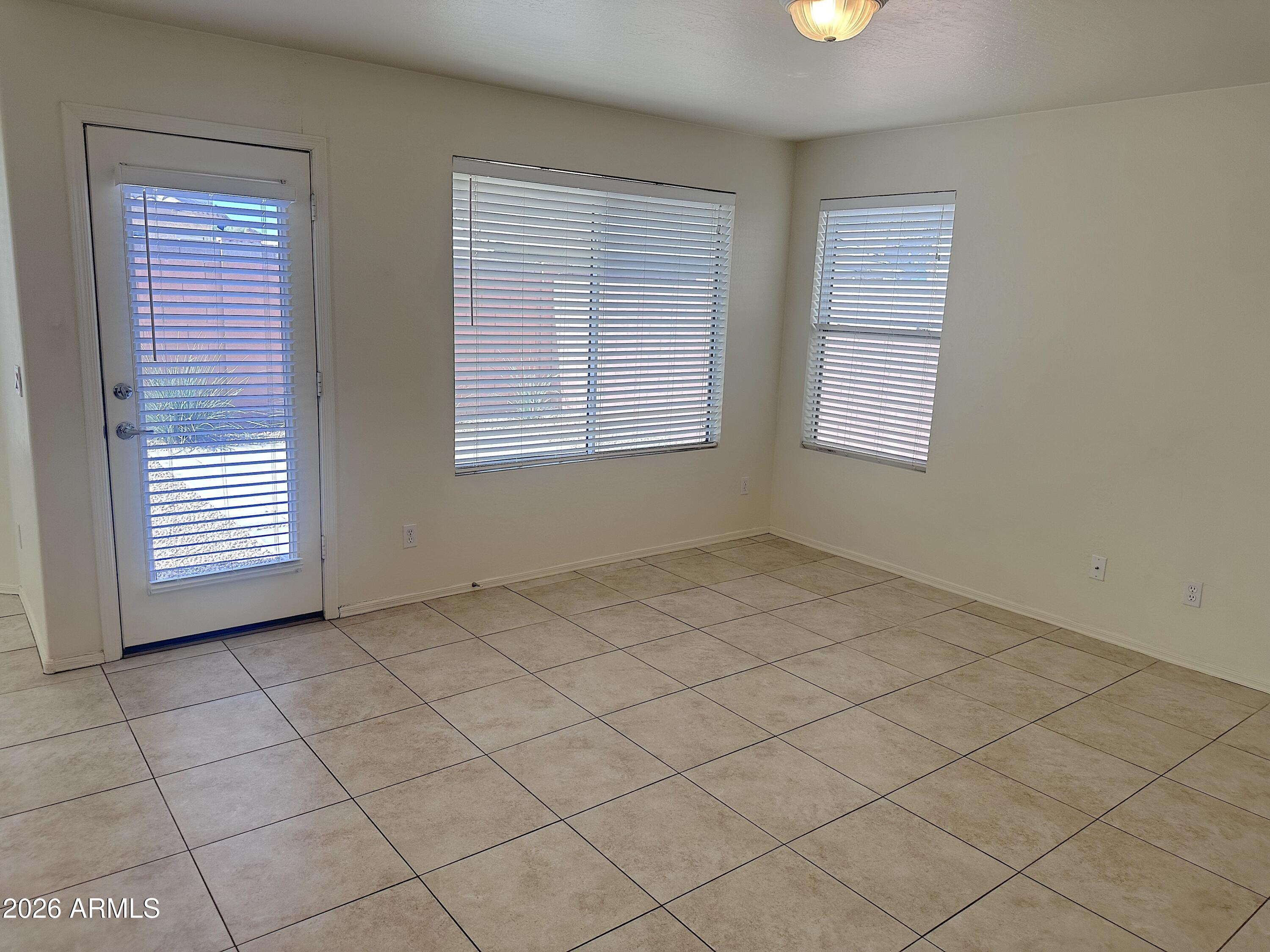 4106 East Chambers Street Phoenix, AZ 85040 - Photo 14 of 33 an empty room with windows