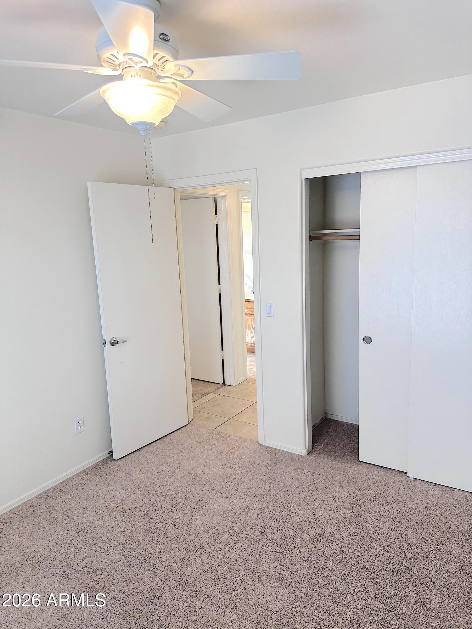 4106 East Chambers Street Phoenix, AZ 85040 - Photo 22 of 33 an empty room with a empty space and a ceiling fan