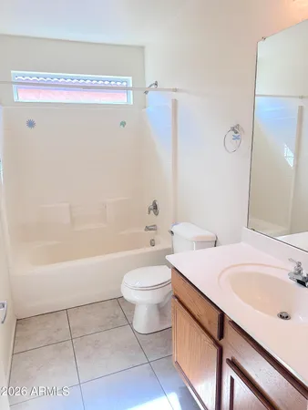 a bathroom with a sink a toilet and bathtub