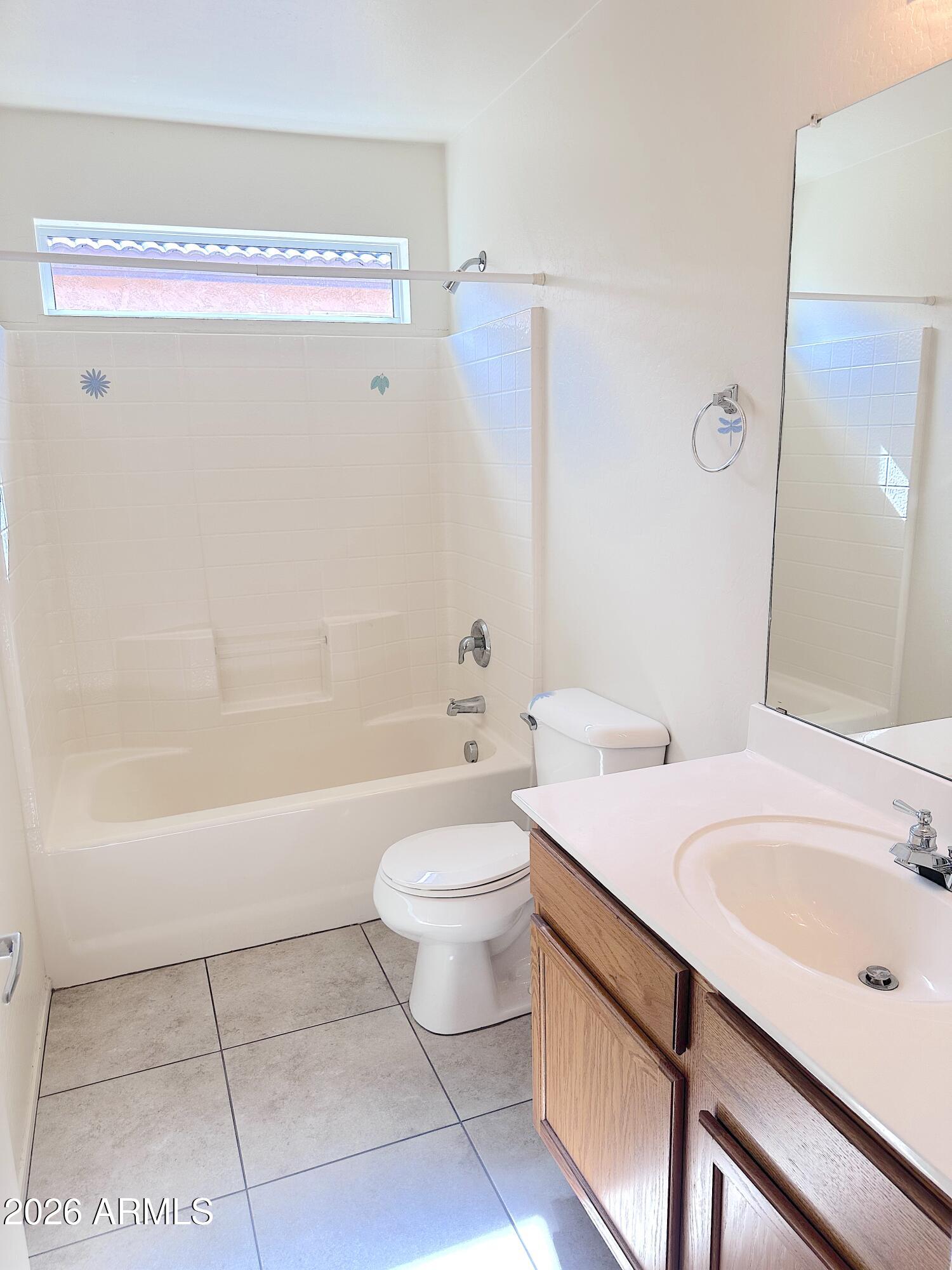 4106 East Chambers Street Phoenix, AZ 85040 - Photo 24 of 33 a bathroom with a sink a toilet and bathtub