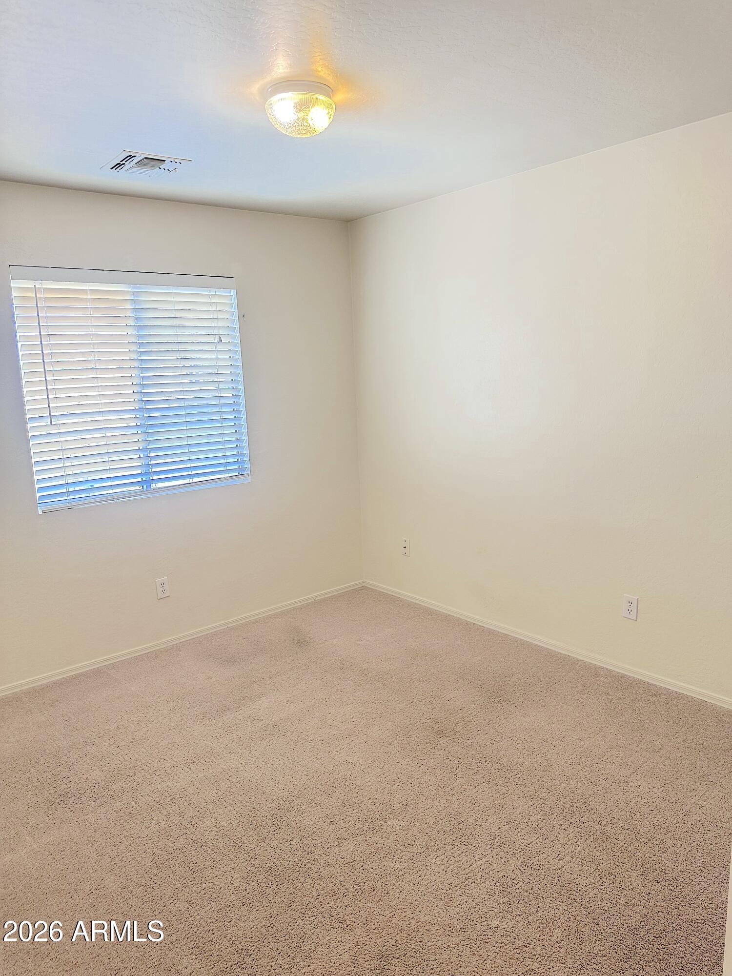 4106 East Chambers Street Phoenix, AZ 85040 - Photo 25 of 33 an empty room with a window