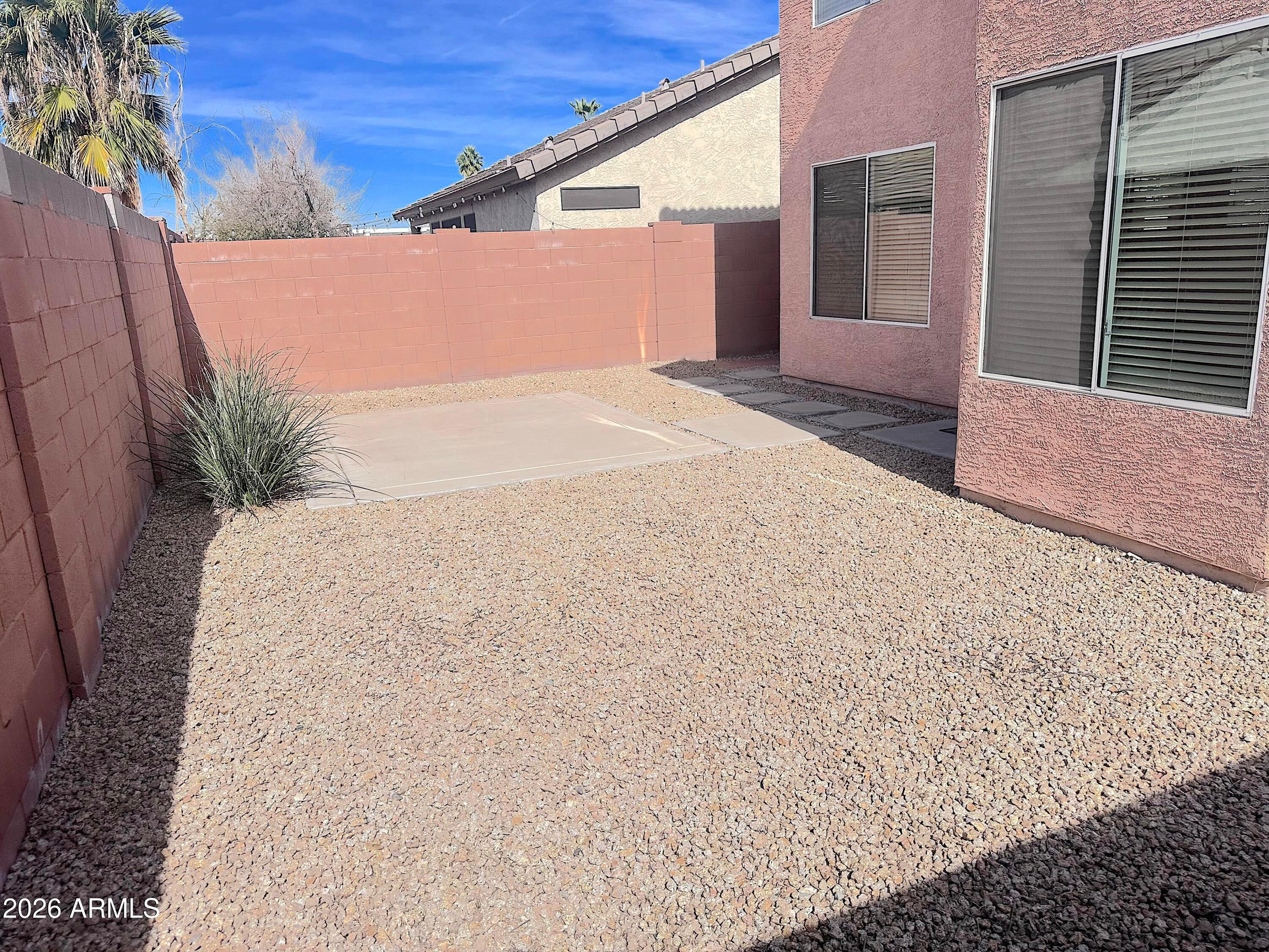 4106 East Chambers Street Phoenix, AZ 85040 - Photo 31 of 33 a backyard of a house with potted plants
