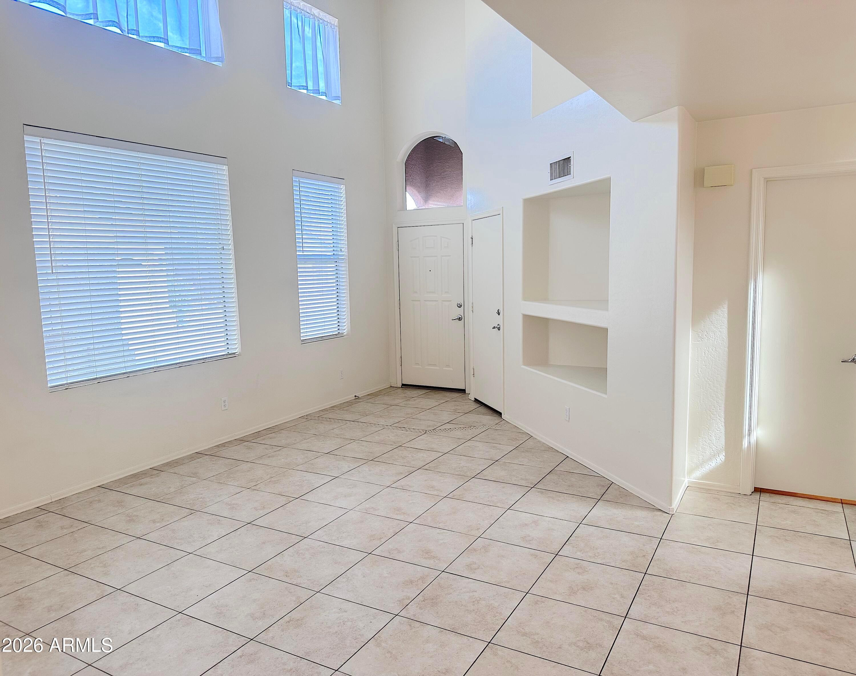 4106 East Chambers Street Phoenix, AZ 85040 - Photo 5 of 33 a view of an empty room with window and closet area