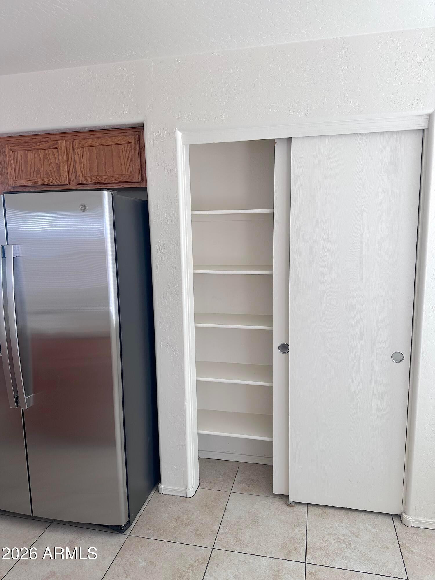 4106 East Chambers Street Phoenix, AZ 85040 - Photo 10 of 33 a view of walk in closet with empty racks