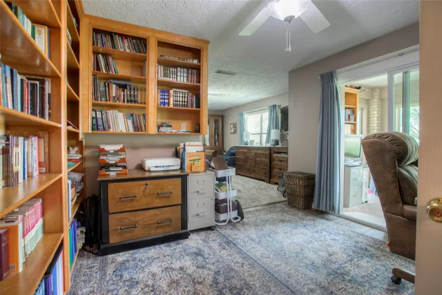 a view of a workspace with furniture and toys