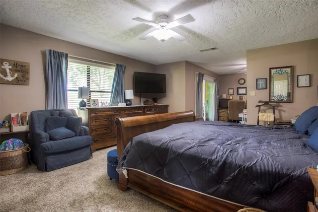 a bathroom with a tub a sink a mirror and a shower