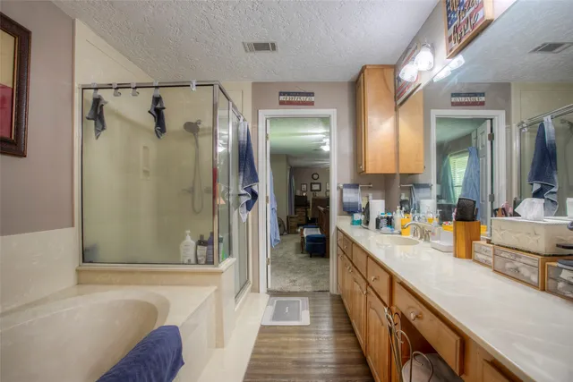 a bathroom with a tub and a shower