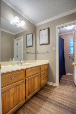 a bedroom with bed and a chandelier