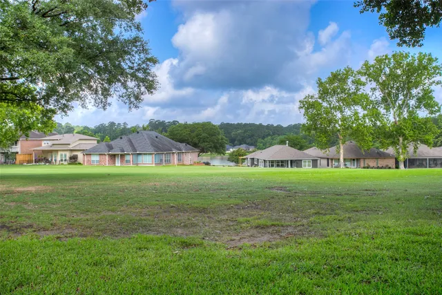a view of a patio with a table chairs and backyard