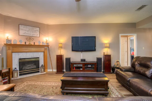 a kitchen with stainless steel appliances granite countertop a sink a stove top oven a counter space and cabinets