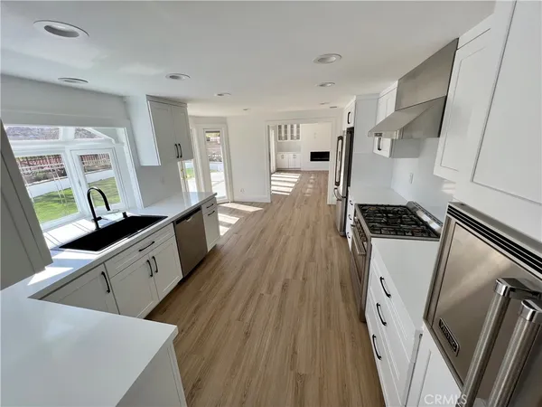 a open kitchen with wooden floor