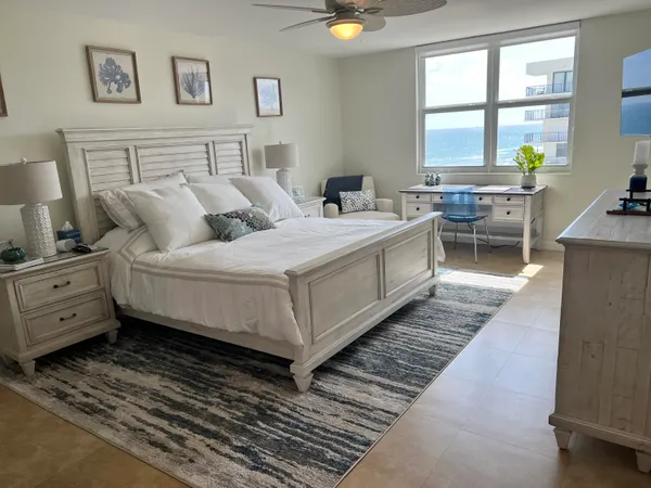 a bedroom with bed and window