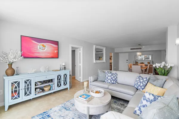 a living room with furniture and a table