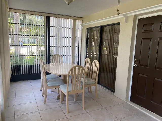 a view of a room with furniture and window