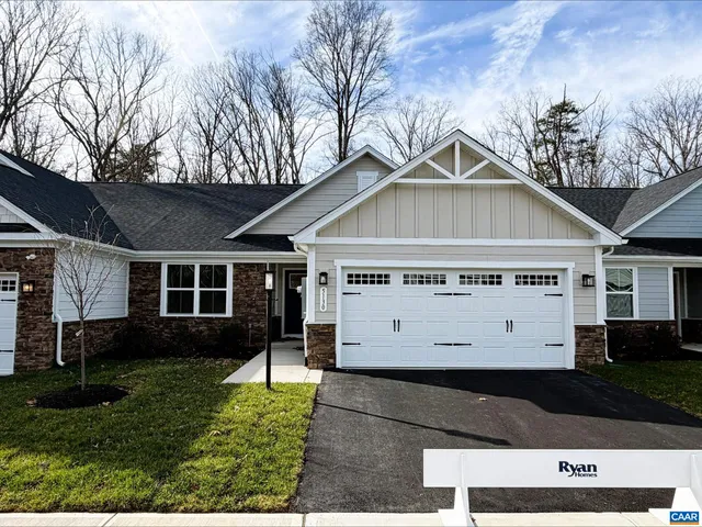 a view of house with yard