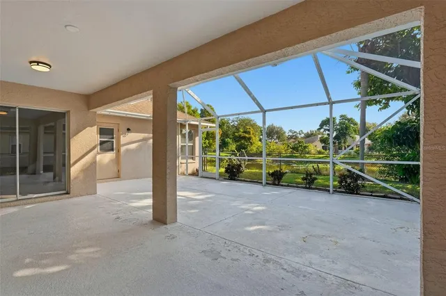 a view of a house with backyard and deck