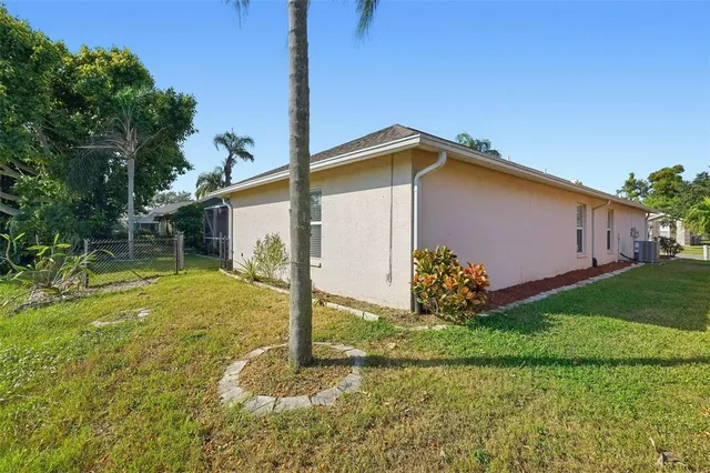 a backyard of a house with plants and entertaining space