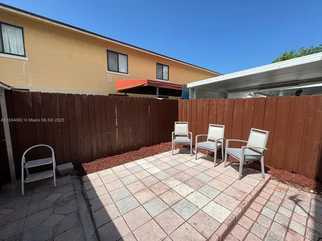 a front view of a house with many windows