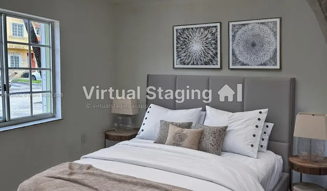 a bedroom with a bed and a painting on the wall