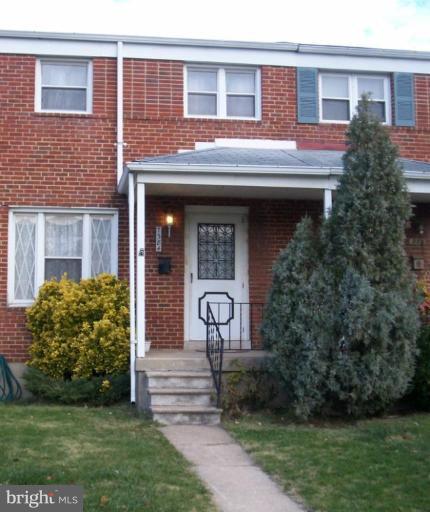 7384 Edsworth Road Dundalk, MD 21222 - Photo 1 of 6 a front view of a house with garden