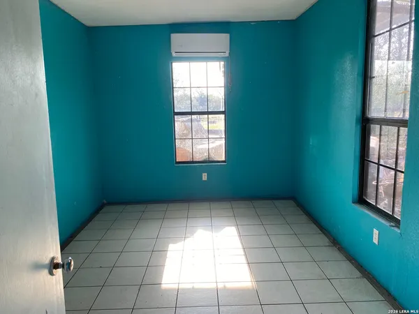 an empty room with windows