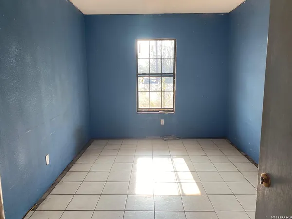 an empty room with a bathroom