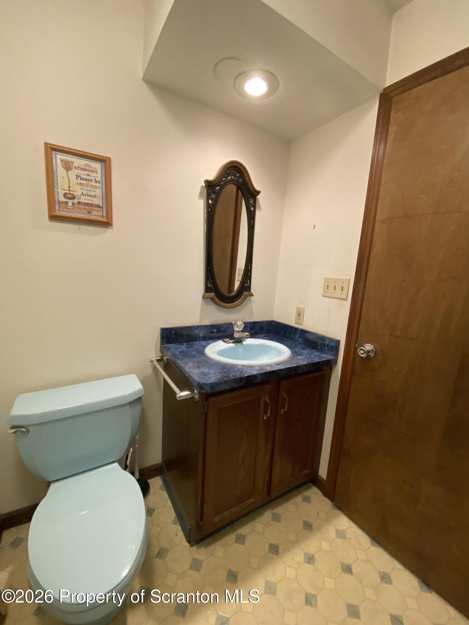 1303 Ridgewood Avenue Scranton, PA 18505 - Photo 15 of 57 a bathroom with a toilet and a sink