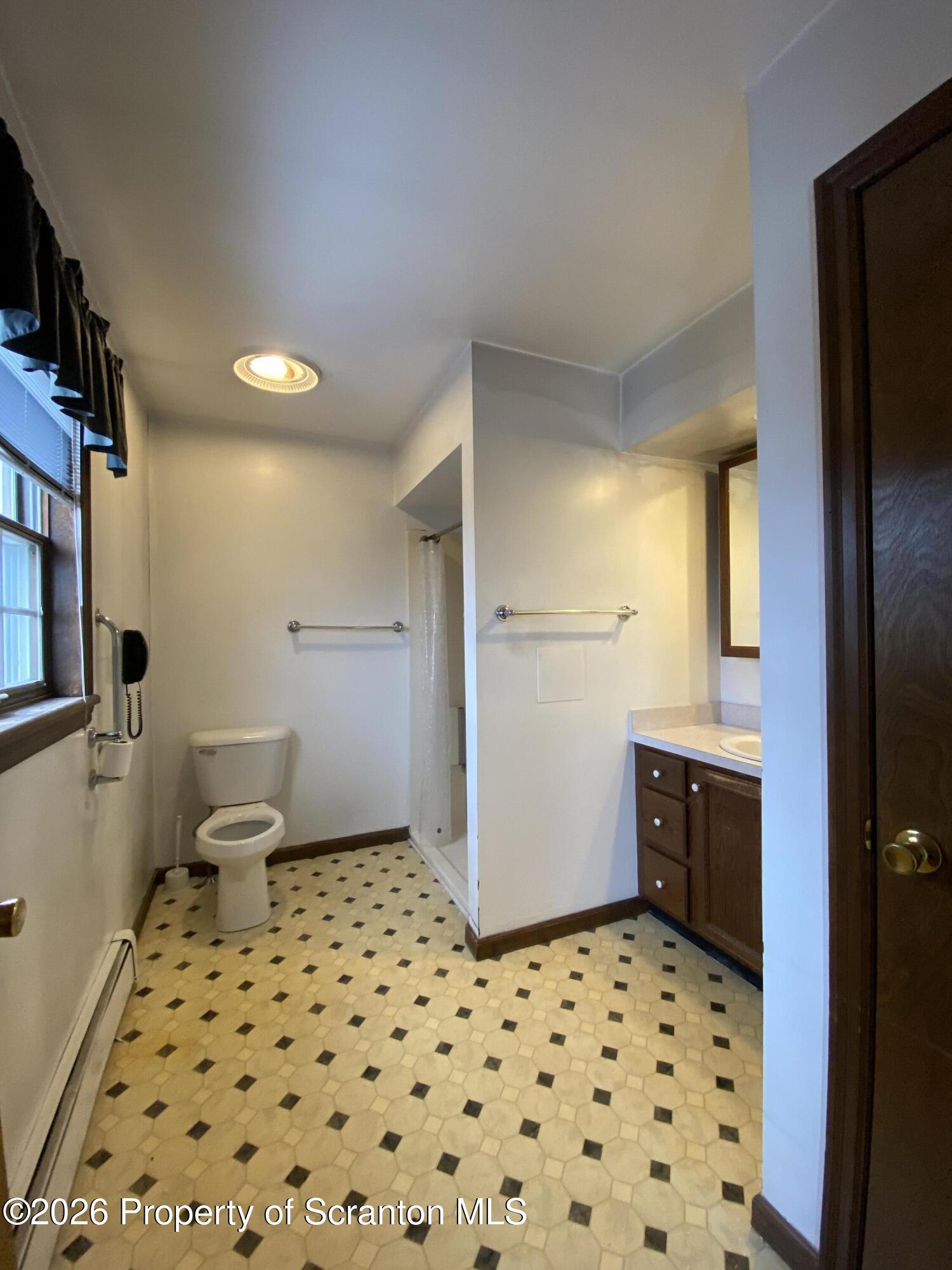 1303 Ridgewood Avenue Scranton, PA 18505 - Photo 18 of 57 a bathroom with a sink toilet and shower