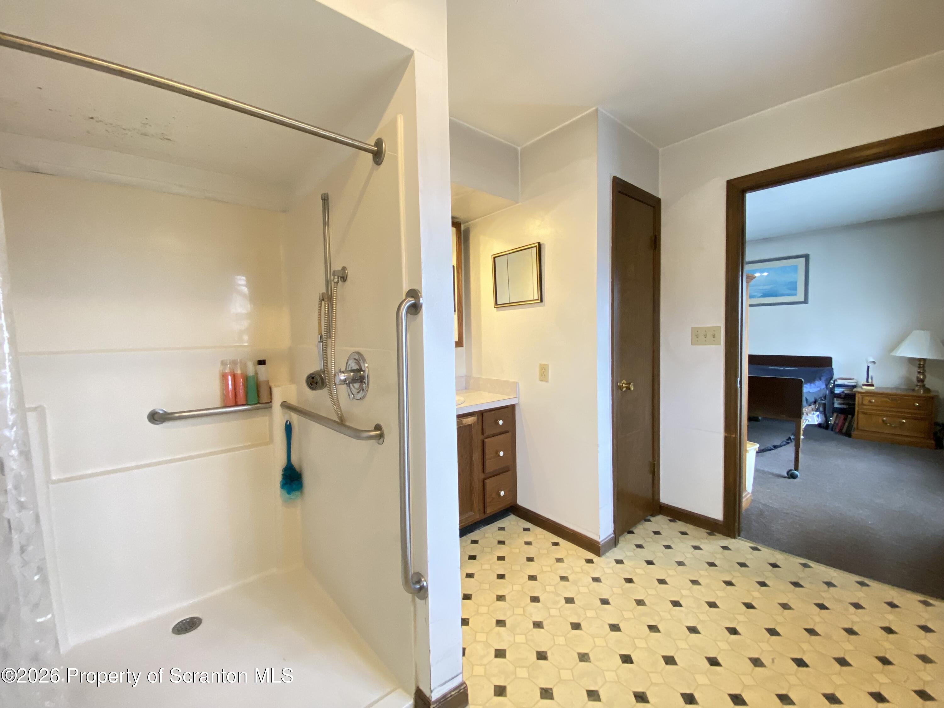 1303 Ridgewood Avenue Scranton, PA 18505 - Photo 20 of 57 a bathroom with a sink toilet and shower