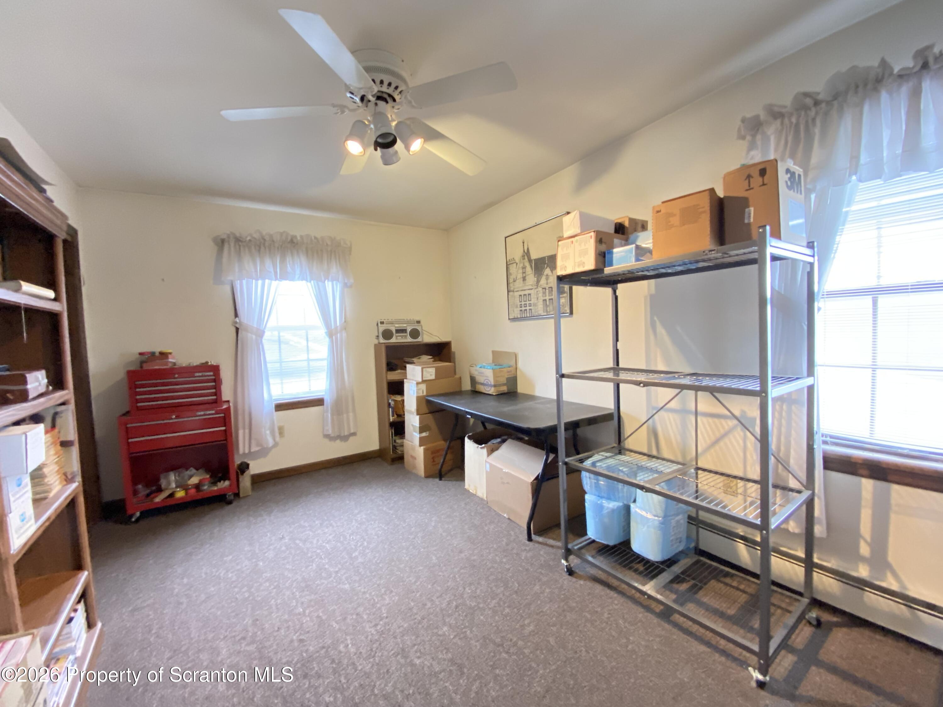 1303 Ridgewood Avenue Scranton, PA 18505 - Photo 21 of 57 a view of a workspace with furniture and a window