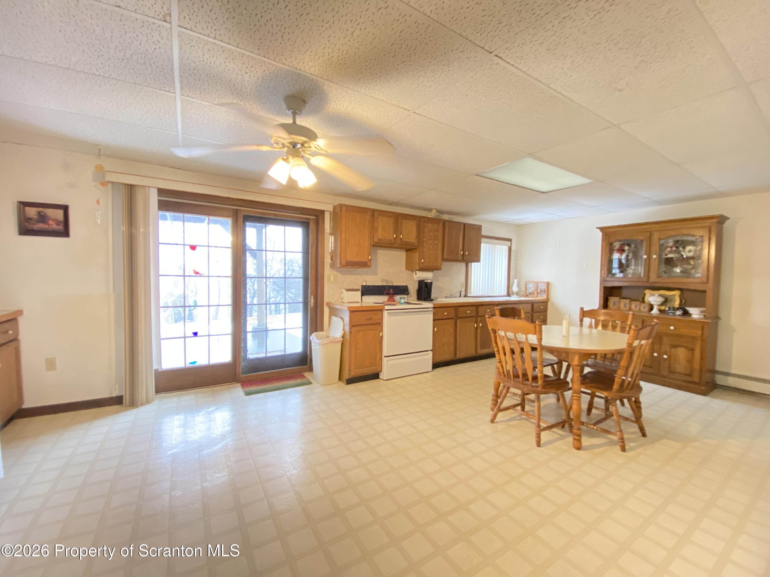 1303 Ridgewood Avenue Scranton, PA 18505 - Photo 28 of 57 a view of a dining room with furniture window and wooden floor