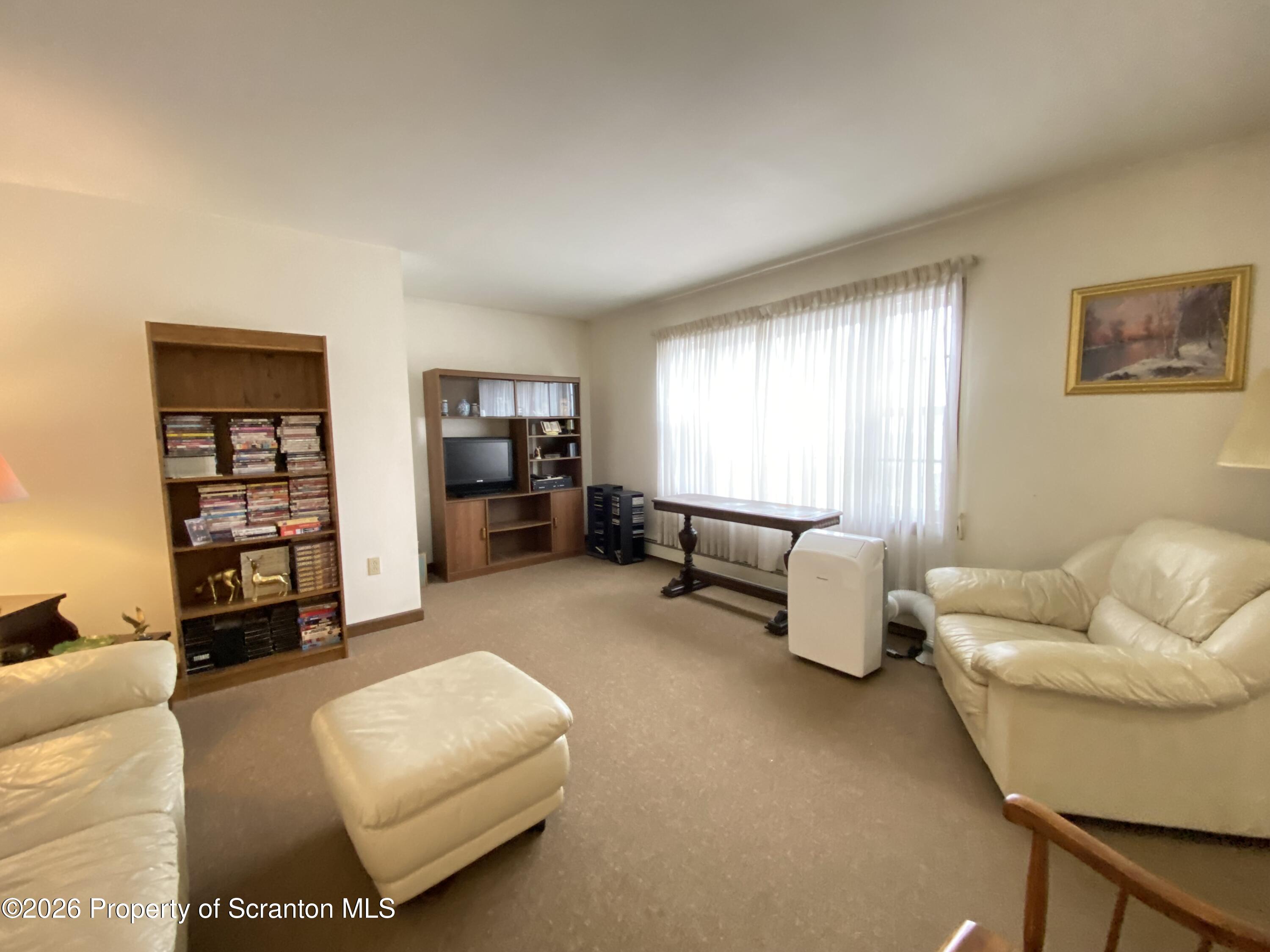 1303 Ridgewood Avenue Scranton, PA 18505 - Photo 3 of 57 a living room with furniture and a couch