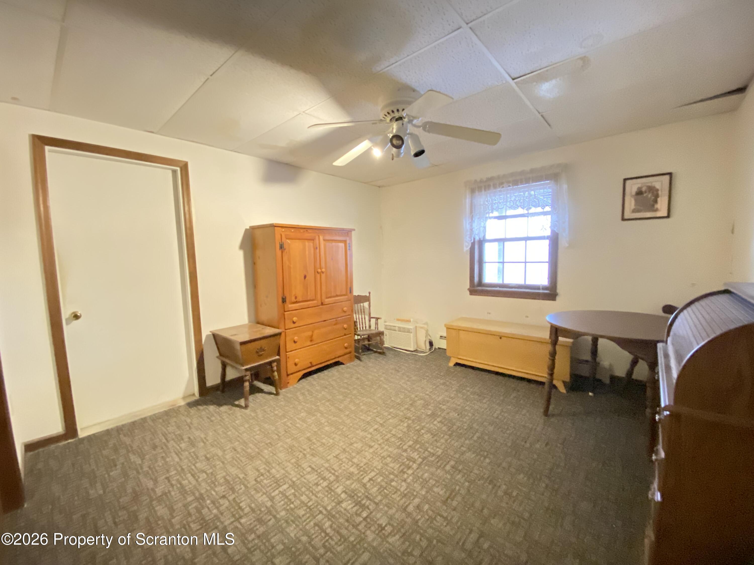 1303 Ridgewood Avenue Scranton, PA 18505 - Photo 37 of 57 a view of a livingroom with workspace and a window