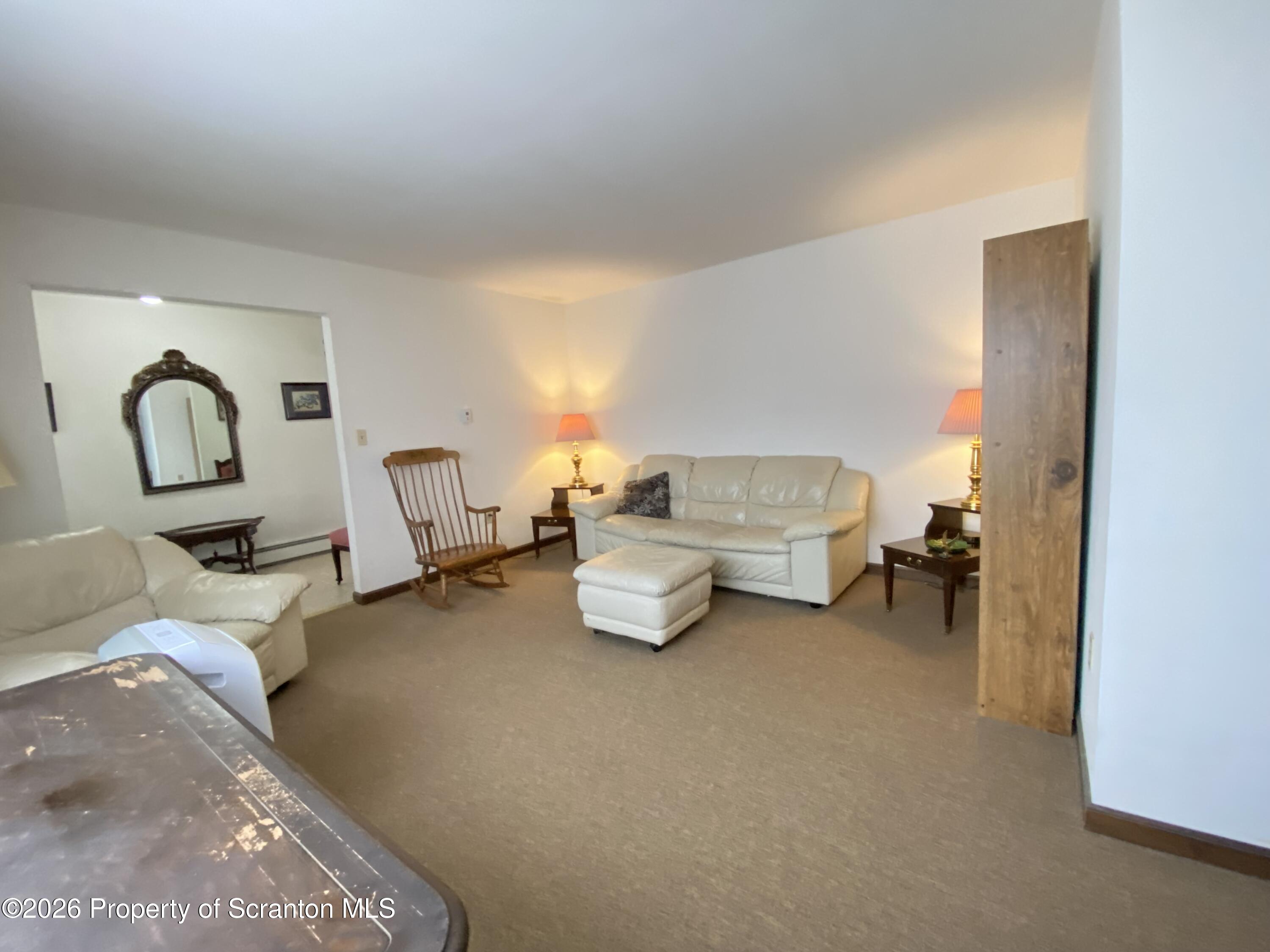1303 Ridgewood Avenue Scranton, PA 18505 - Photo 4 of 57 a living room with furniture and a table