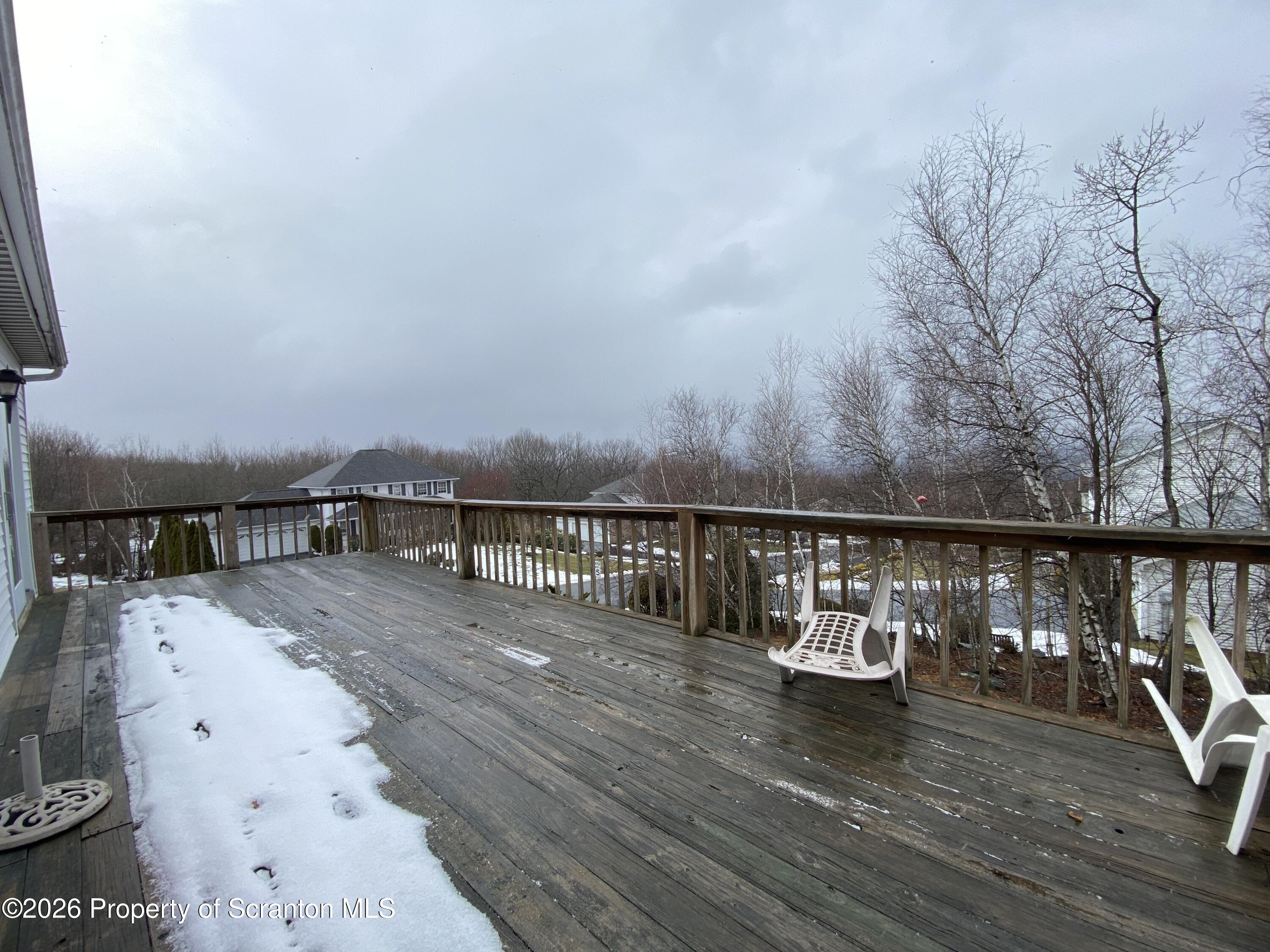 1303 Ridgewood Avenue Scranton, PA 18505 - Photo 46 of 57 a view of roof deck with two chairs and wooden floor