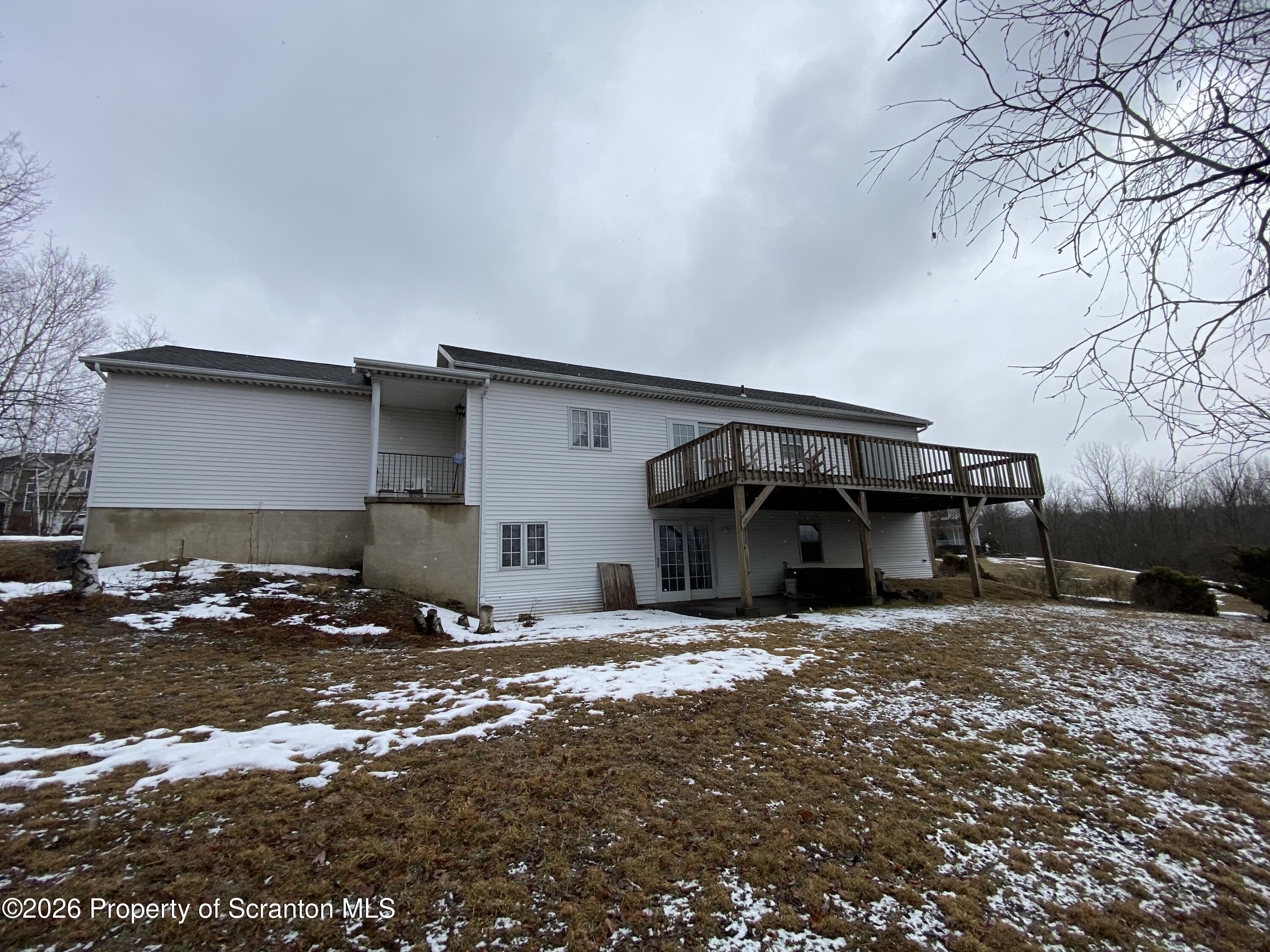 1303 Ridgewood Avenue Scranton, PA 18505 - Photo 54 of 57 a view of a house with snow in front of it