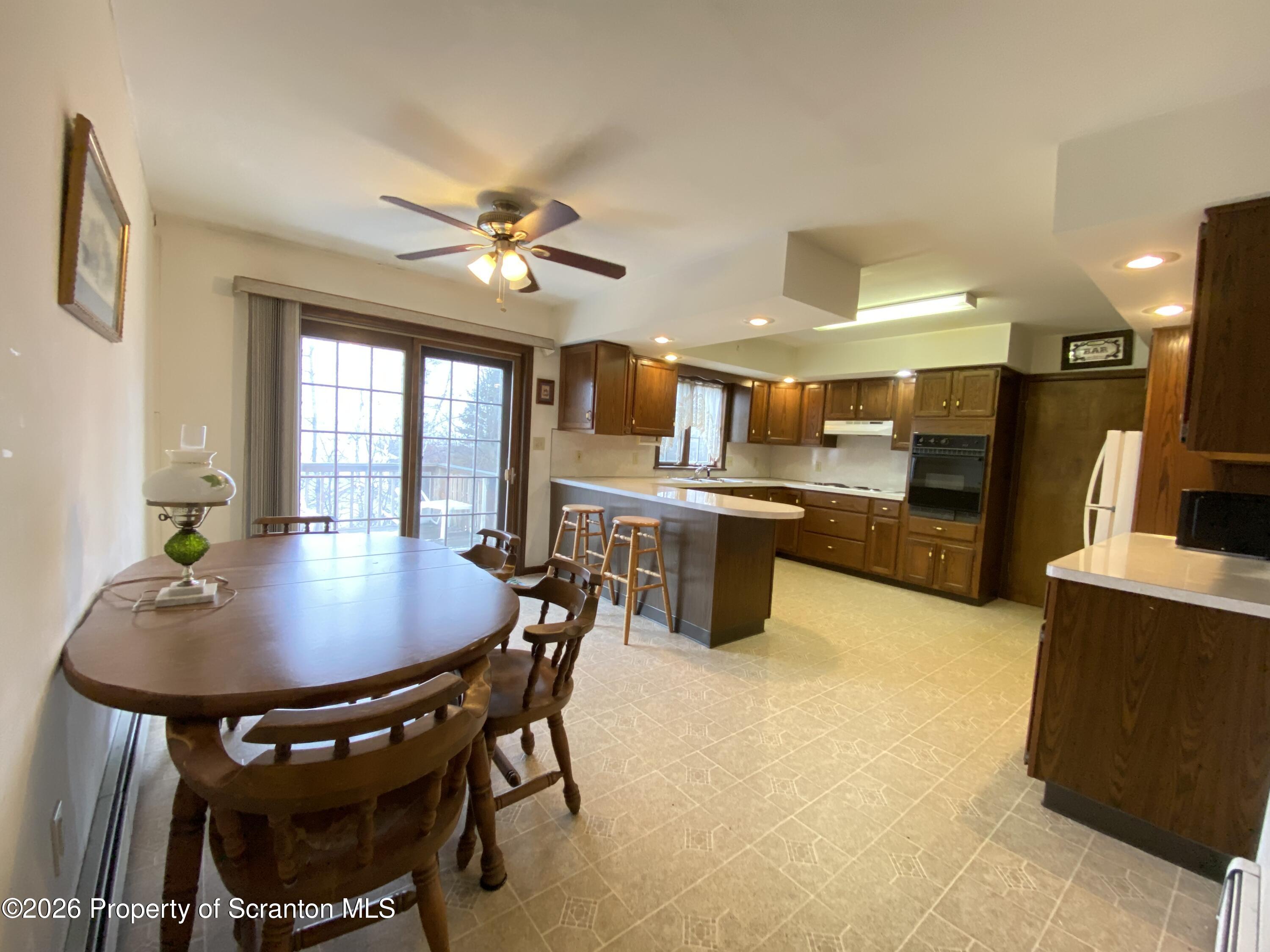 1303 Ridgewood Avenue Scranton, PA 18505 - Photo 7 of 57 a dining room with furniture and window