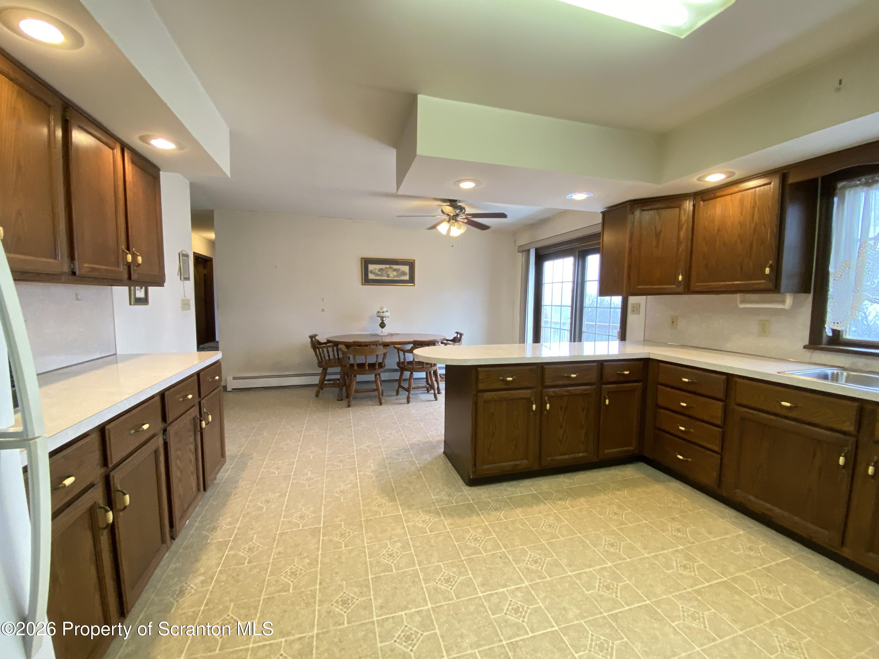 1303 Ridgewood Avenue Scranton, PA 18505 - Photo 8 of 57 a large kitchen with a large counter top cabinets and stainless steel appliances
