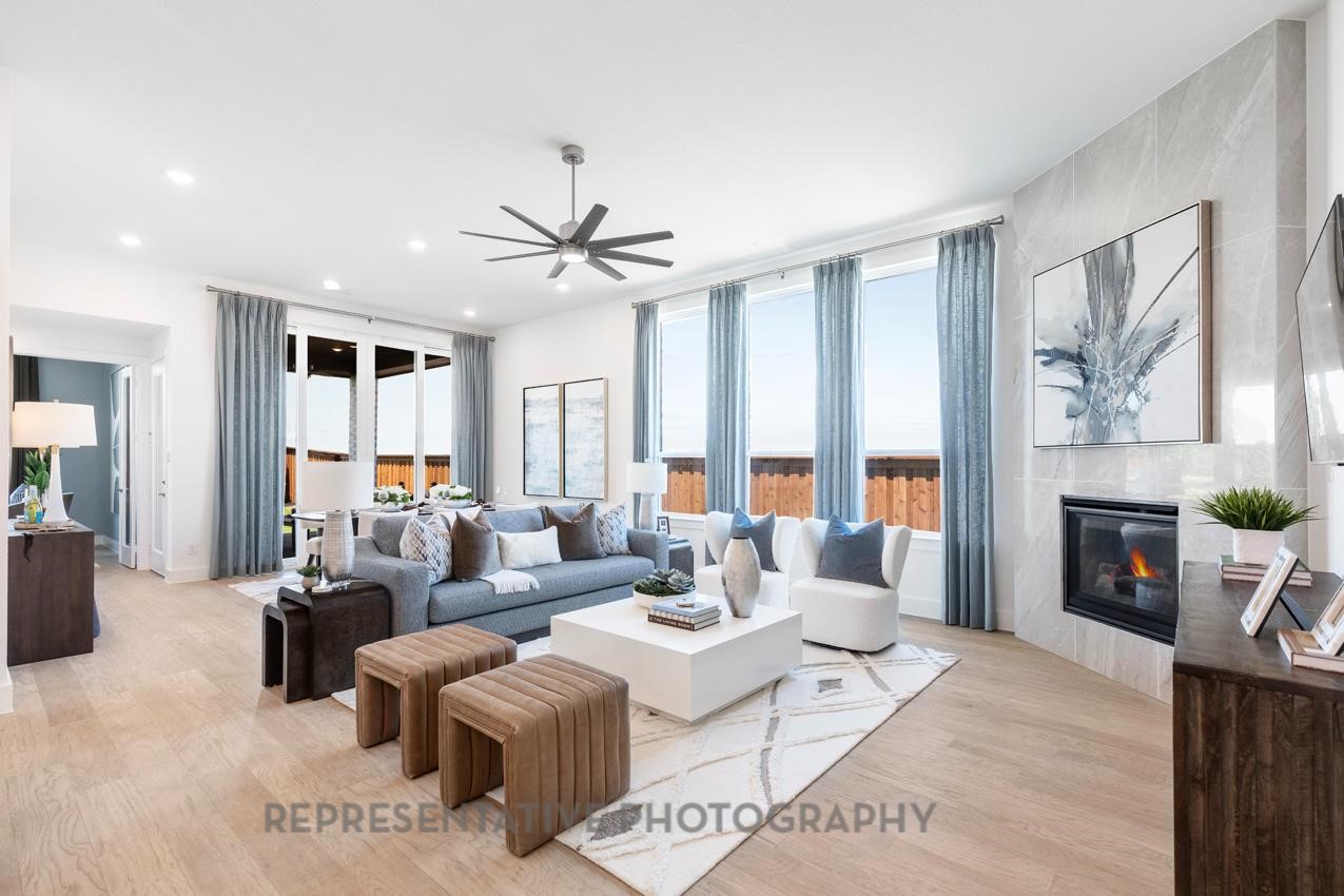 22214 Mount Whitney Road Waller, TX 77484 - Photo 17 of 50 a living room with furniture a large window and a fireplace
