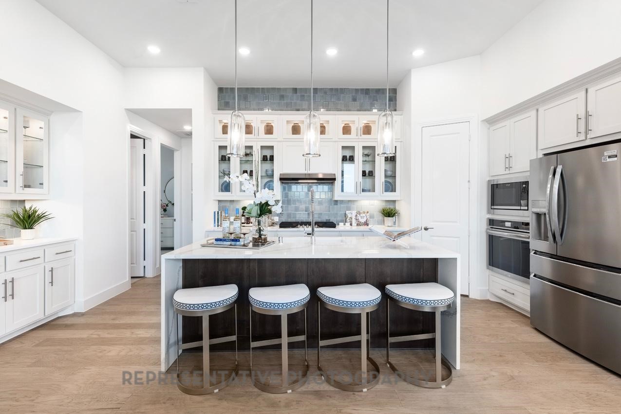 22214 Mount Whitney Road Waller, TX 77484 - Photo 2 of 50 a large kitchen with a table and chairs