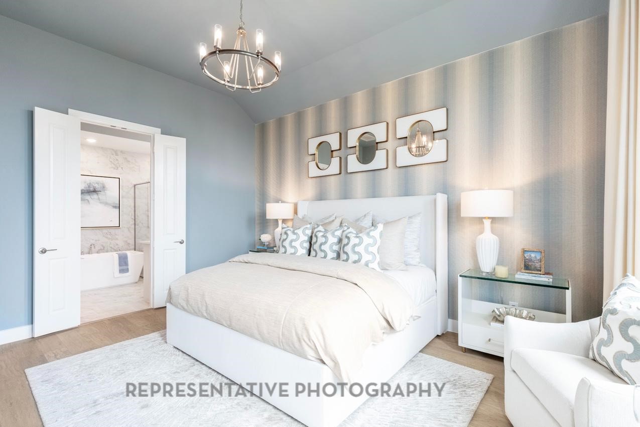 22214 Mount Whitney Road Waller, TX 77484 - Photo 22 of 50 a spacious bedroom with a bed and a table