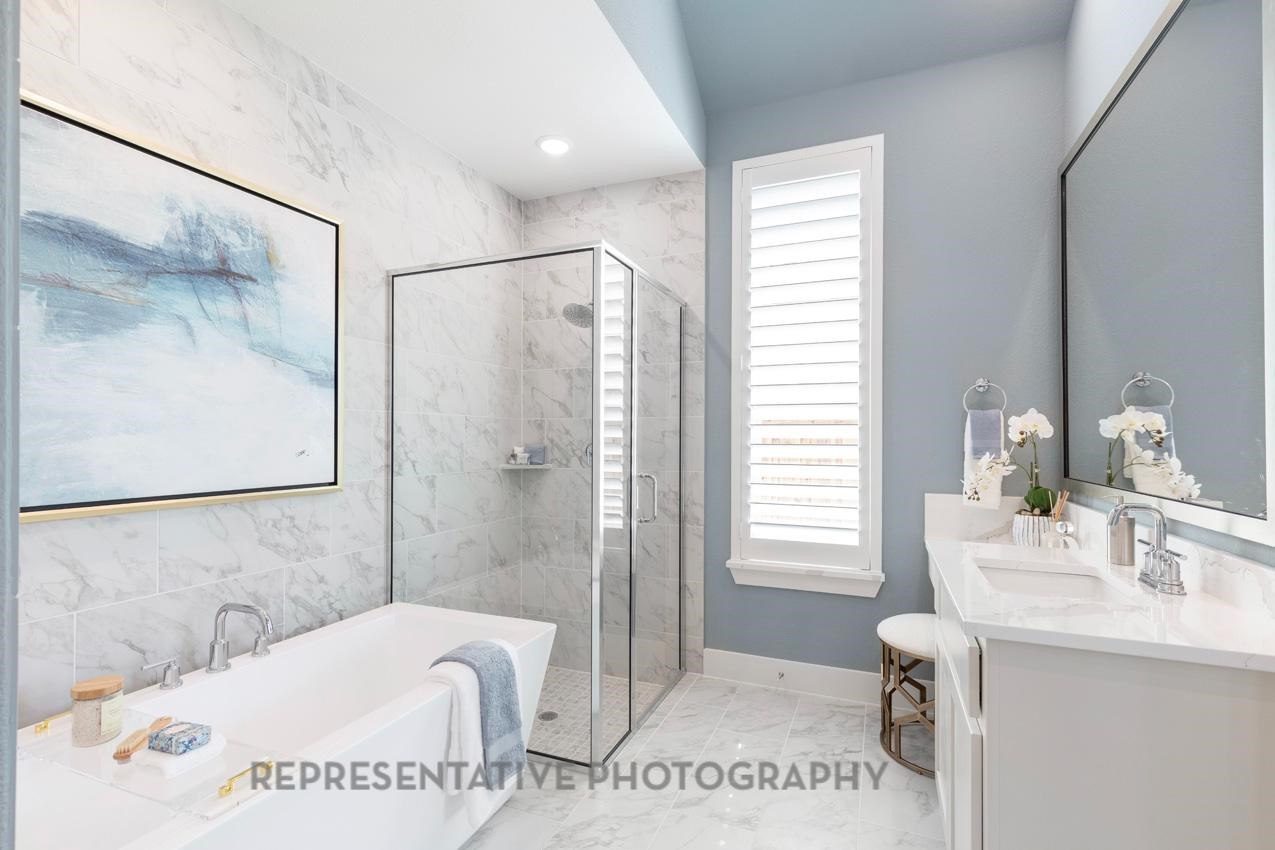 22214 Mount Whitney Road Waller, TX 77484 - Photo 25 of 50 a bathroom with a tub a sink and a mirror