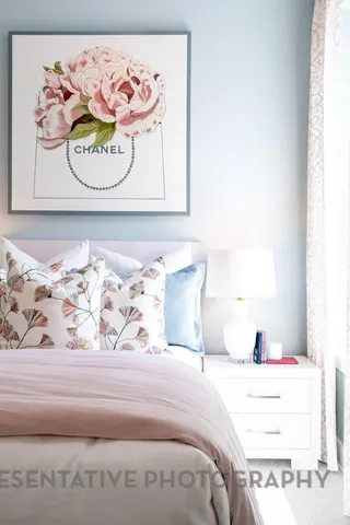 a bedroom with a bed and a night stand