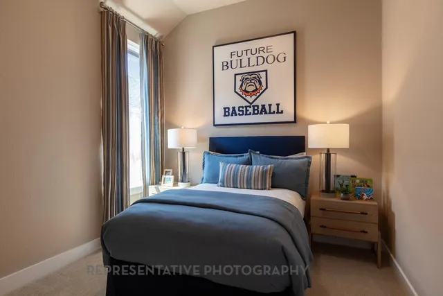 a view of a bedroom with bed and furniture
