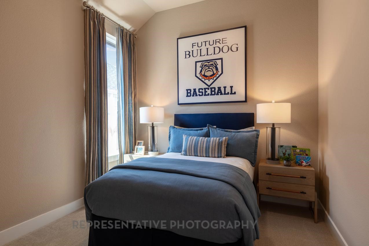 22214 Mount Whitney Road Waller, TX 77484 - Photo 39 of 50 a bedroom with a bed and a night stand