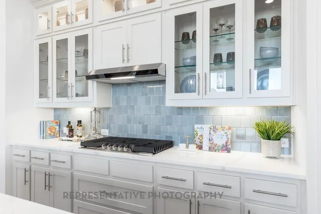 a kitchen with stainless steel appliances a sink stove and refrigerator